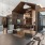 a room with tall ceilings, tables and chairs