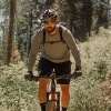 man riding a bike on a trail in the woods